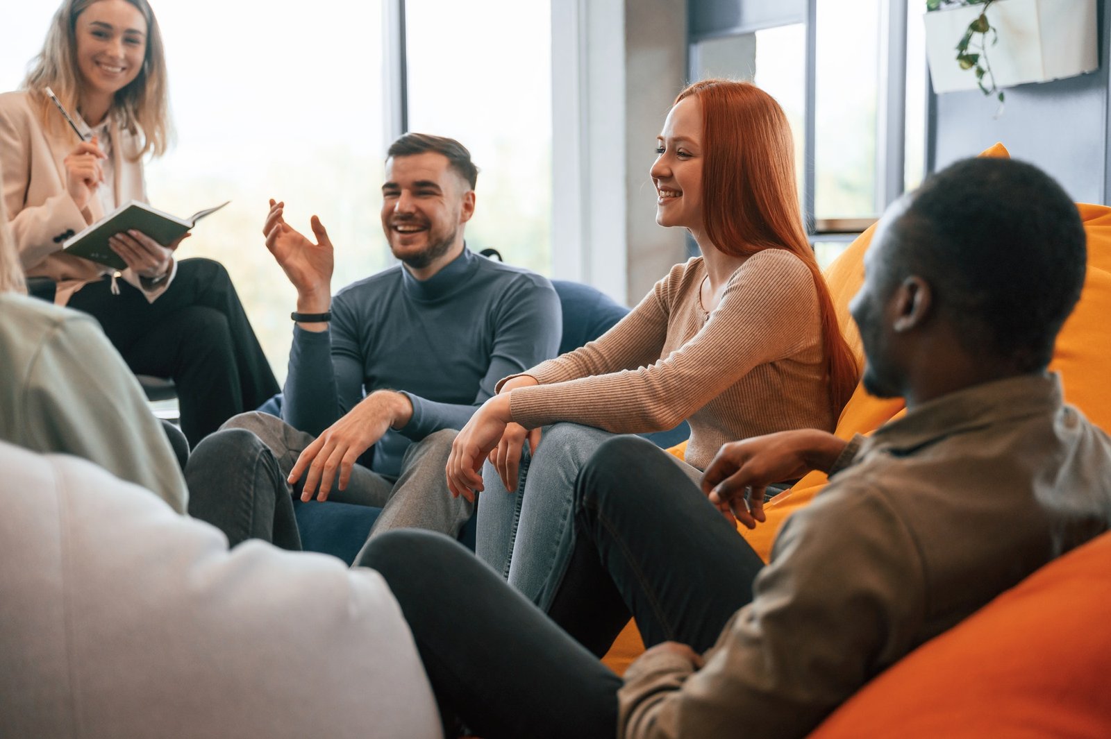 Conception of mental health, sitting and talking. Group of people are having therapy meeting