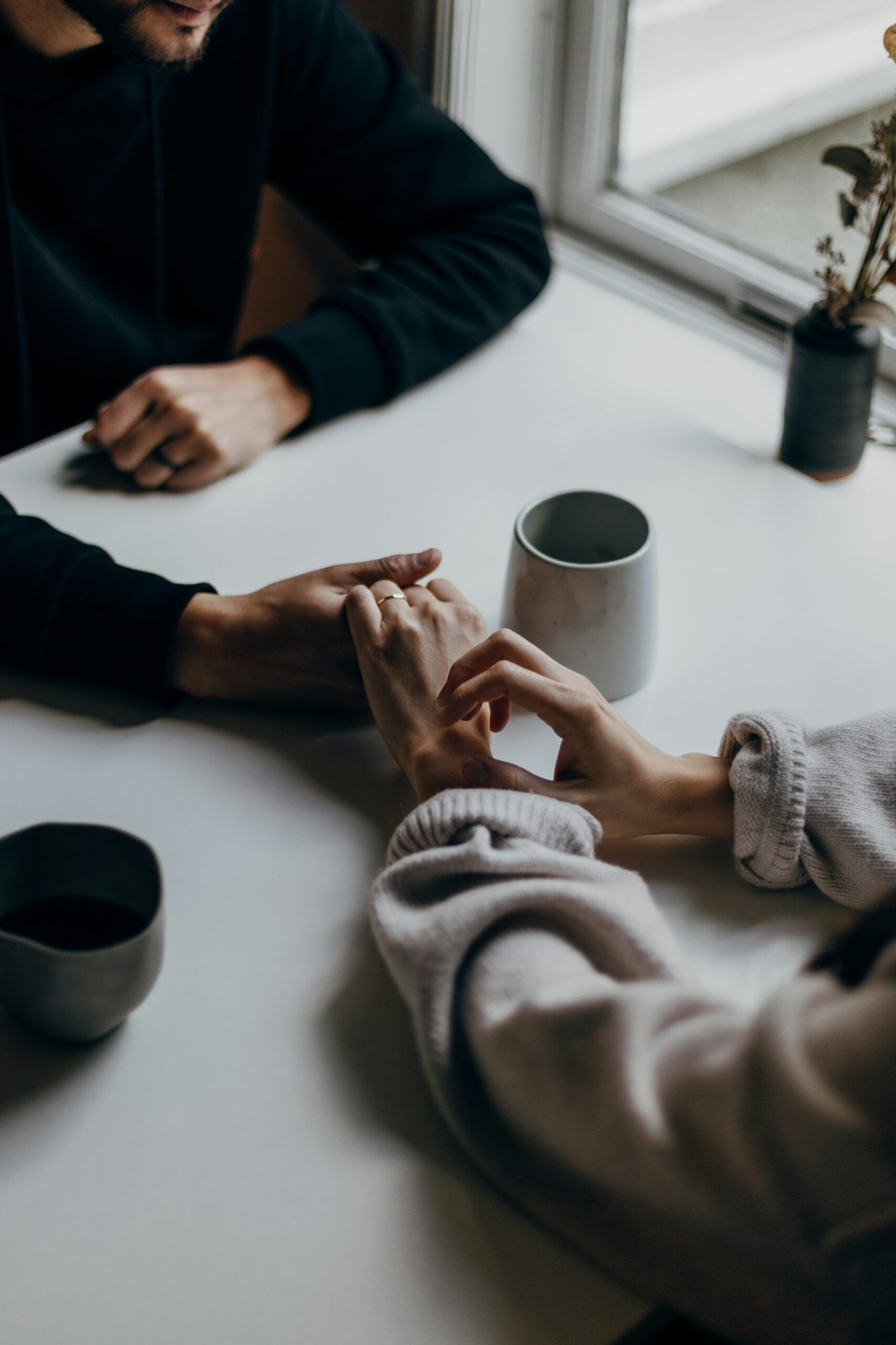 two people holding hands.